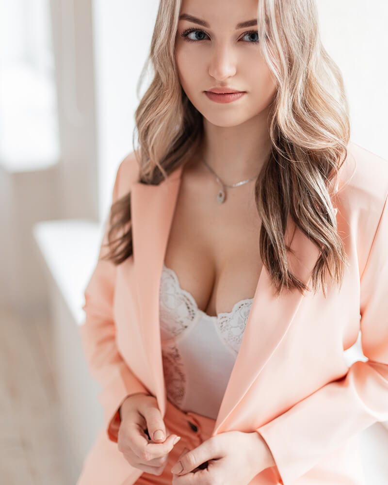 Woman in a peach colored blazer