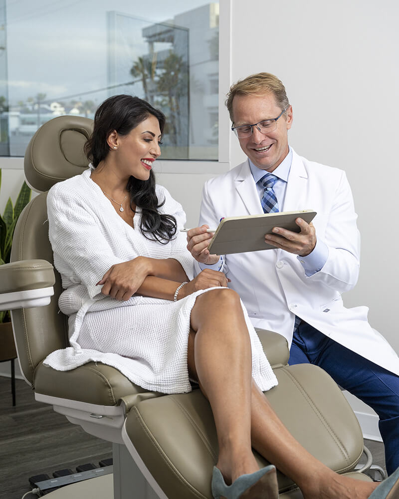 Woman getting a consultation with Dr. Strawn